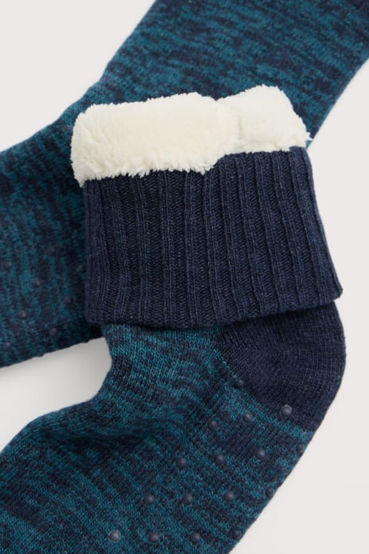 des hommes tricotés maison de chaussettes